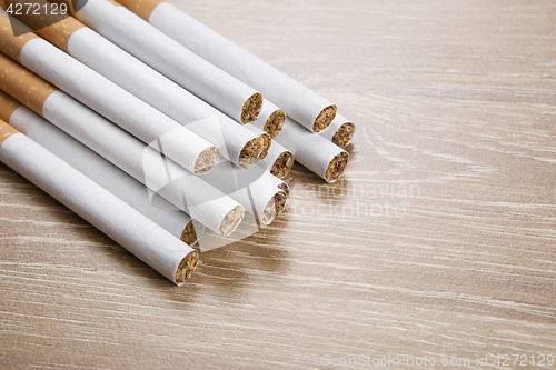 Image of Cigarettes on brown background