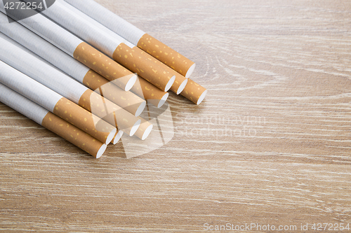 Image of Cigarettes on brown background