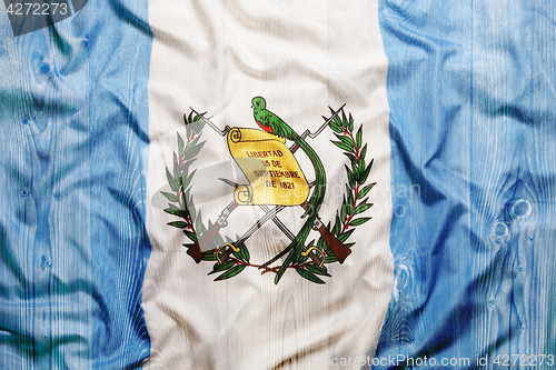 Image of National flag of Guatemala, wooden background