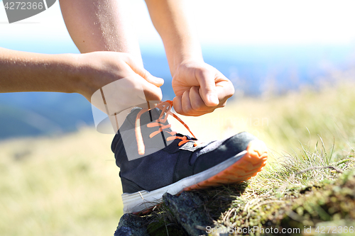 Image of Tying shoelaces.