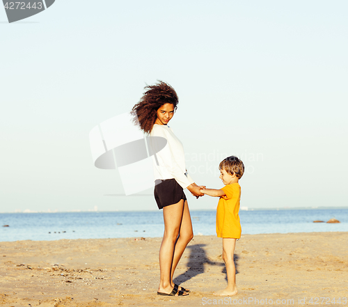 Image of pretty diverse nation and age friends on sea coast having fun, lifestyle people concept on beach vacations close up