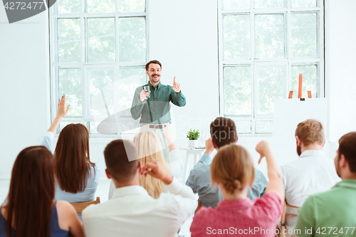 Image of Speaker at Business Meeting in the conference hall.