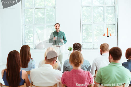 Image of Speaker at Business Meeting in the conference hall.