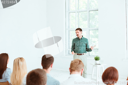 Image of Speaker at Business Meeting in the conference hall.