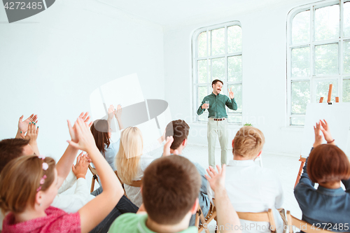 Image of Speaker at Business Meeting in the conference hall.