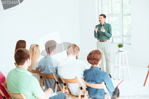 Image of Speaker at Business Meeting in the conference hall.