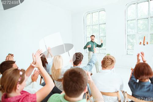 Image of Speaker at Business Meeting in the conference hall.