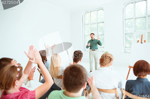 Image of Speaker at Business Meeting in the conference hall.