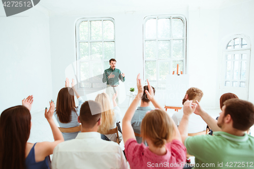 Image of Speaker at Business Meeting in the conference hall.