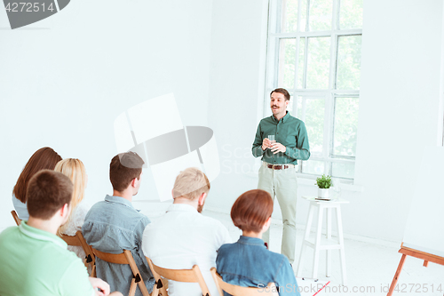 Image of Speaker at Business Meeting in the conference hall.