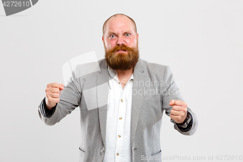 Image of Angry man clenching his fists