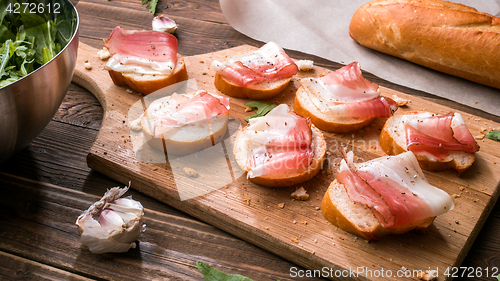 Image of Wooden cutting board with bacon