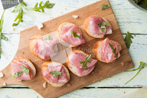 Image of Baguette with ham on board