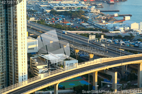 Image of highway in city downtown at day