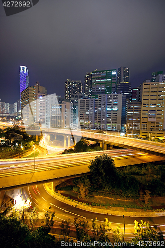 Image of urban area dusk, busy traffic 