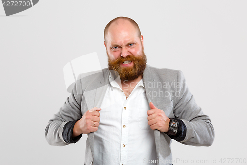 Image of Dissatisfied man in gray jacket