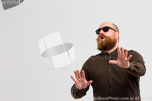 Image of Blind man stretched arms forward