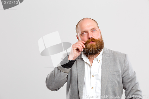 Image of Pensive man with mustache, beard ,