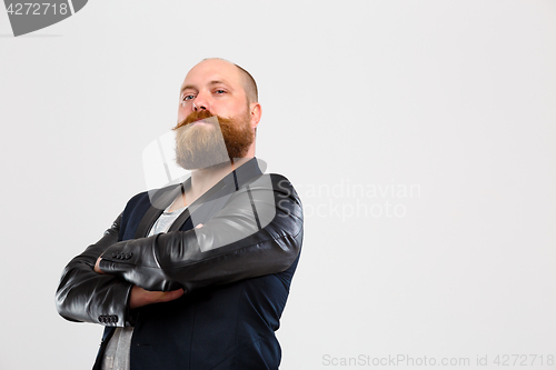 Image of Brutal man with arms folded