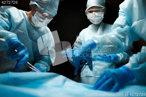 Image of Image of doctors with instruments