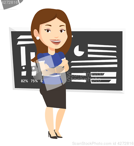 Image of Teacher or student standing in front of chalkboard