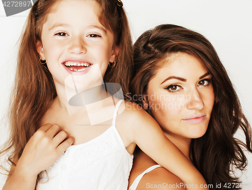 Image of young mother with little cute daughter emotional posing on white