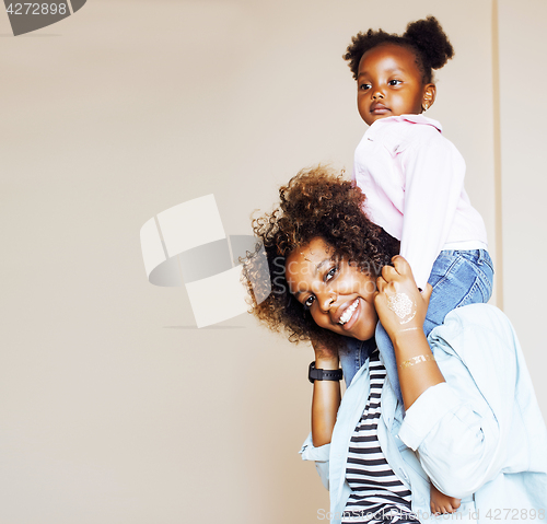 Image of adorable sweet young afro-american mother with cute little daugh