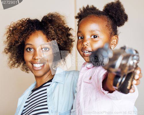 Image of adorable sweet young afro-american mother with cute little daugh