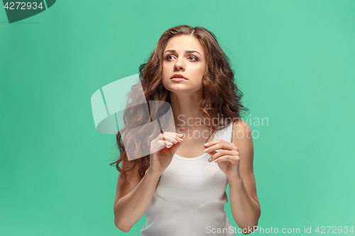 Image of Portrait of young woman with shocked facial expression