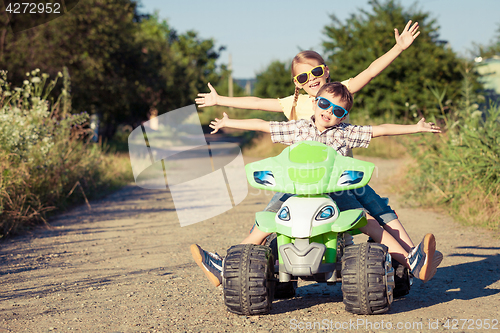 Image of Happy little boy playing on road at the day time.