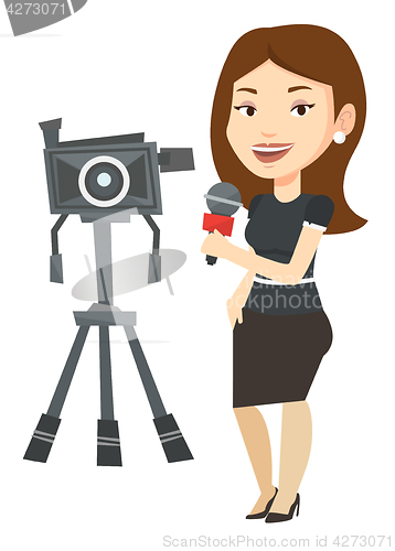 Image of TV reporter with microphone and camera.