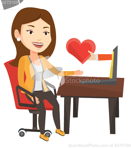 Image of Young woman dating online using laptop.