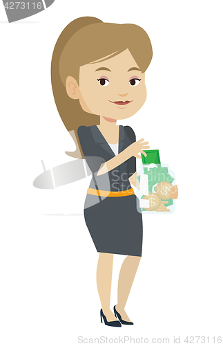 Image of Woman putting dollar money into glass jar.