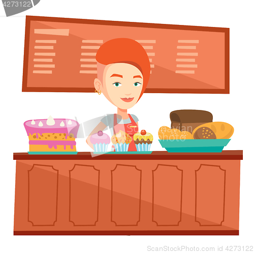 Image of Worker standing behind the counter at the bakery.
