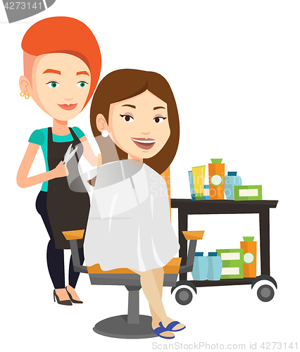 Image of Hairdresser making haircut to young woman.