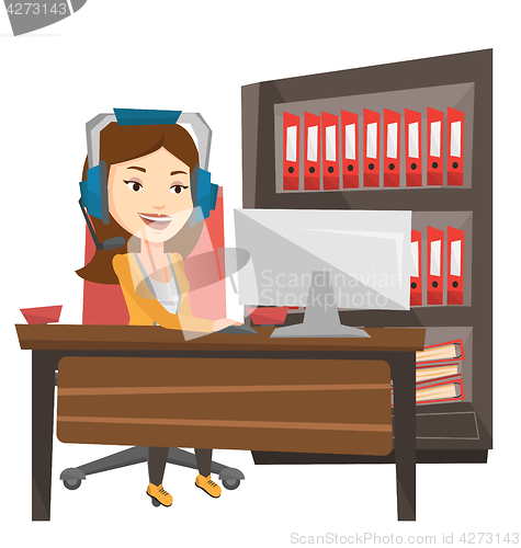 Image of Business woman with headset working at office.