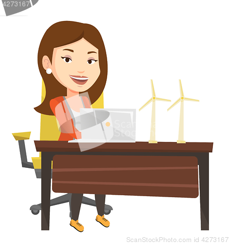 Image of Woman working with model of wind turbines.