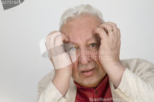 Image of Senior man with strong headache