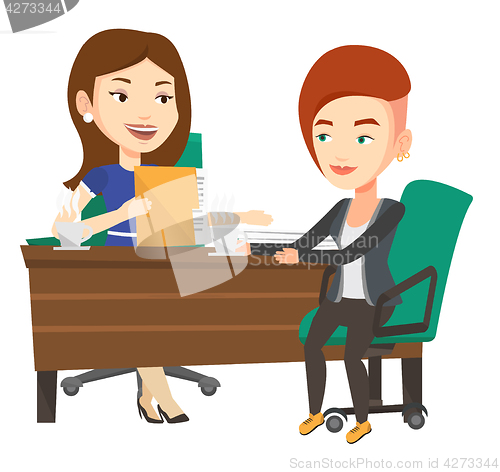 Image of Two businesswomen during business meeting.