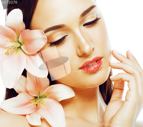 Image of young attractive lady close up with hands on face isolated flowe