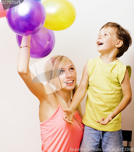 Image of pretty real family with color balloons on white background, blon