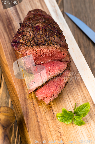 Image of Beef Top Sirloin Steak Roast Sliced Coooked Medium Rare 