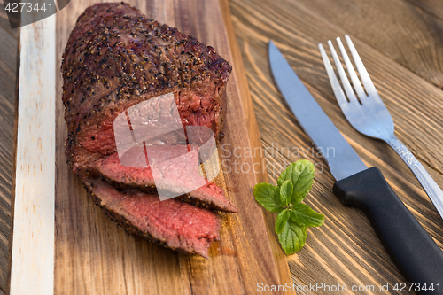 Image of Beef Top Sirloin Steak Roast Sliced Coooked Medium Rare