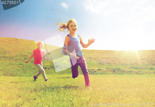 Image of group of happy kids running outdoors