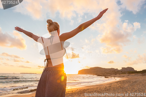 Image of Free Happy Woman Enjoying Sunset on Sandy Beach