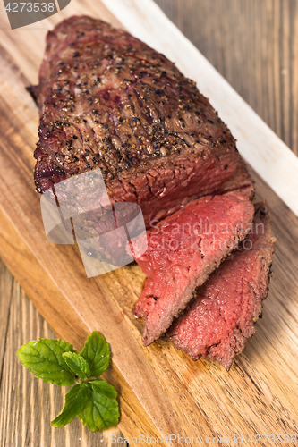 Image of Beef Top Sirloin Steak Roast Sliced Coooked Medium Rare