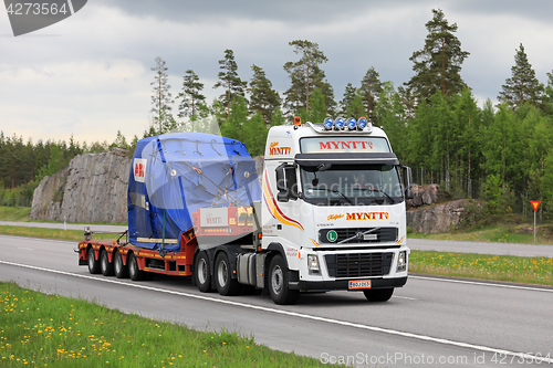 Image of Volvo Truck Transports Industrial Object along Motorway