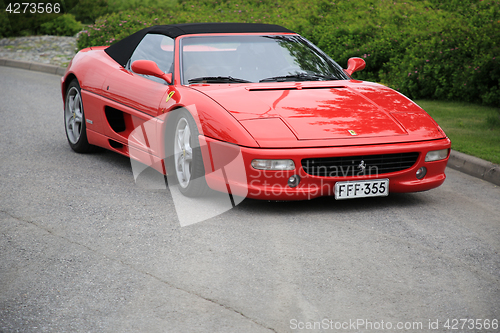 Image of Red Ferrari Convertible Parked