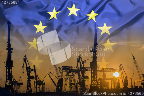 Image of Industrial concept with European Union flag at sunset