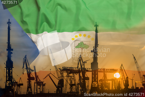 Image of Industrial concept with Equatorial Guinea flag at sunset